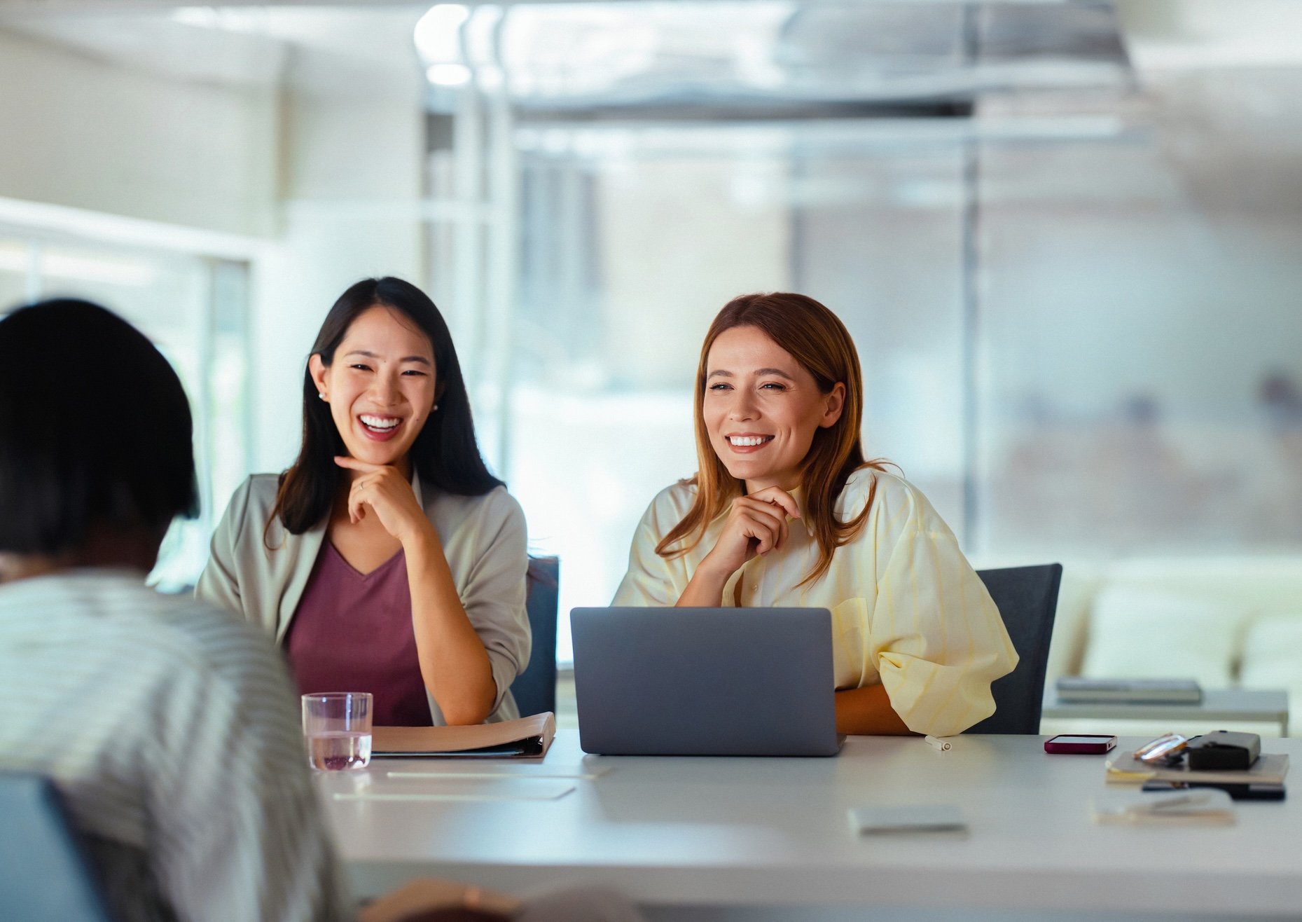 Three people having a meeting in an office